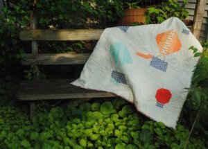 Hot air balloon quilt on bench